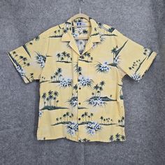 RJC Hawaiian Shirt Yellow Palm Trees Tropical Camp Paradise Button Up USA VTGVery Good Preowned Condition See pictures for measurements. Size on Tag can be different from actual size of the item due to previous washings. All clothes are clean and stored in Smoke Free and Pet Free environment. We offer same day shipping. Button-up Short Sleeve Beach Shirt, Cotton Tops With Buttons For Vacation, Collared Camp Shirt With Buttons For Beach, Hawaiian Summer Shirt With Buttons, Yellow Button-up Hawaiian Shirt For Spring, Yellow Spring Button-up Hawaiian Shirt, Hawaiian Vacation Tops With Buttons, Summer Tops With Camp Collar And Buttons, Yellow Hawaiian Cotton Top