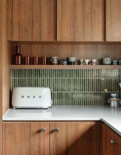 a toaster sitting on top of a kitchen counter