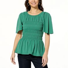 DG2 by Diane Gilman Smocked Bodice Flutter-Sleeve Top  A playfully flouncy silhouette with short flutter sleeves and a flared peplum hem, this smocked top is ready to take you places! Flaring to the hips in a flattering silhouette, this feminine frock pairs easily with the bottoms of your choosing. Casual Smocked Top With Flutter Sleeves, Stretch Elastic Sleeved Short Sleeve Tops, Stretch Top With Elastic Short Sleeves, Stretch Short Sleeve Tops With Elastic Sleeves, Casual Smocked Top With Ruched Ruffle Sleeves, Fitted Tops With Smocked Bodice And Flutter Sleeve, Summer Tops With Ruffle Elastic Sleeves, Spring Casual Smocked Top With Flutter Sleeves, Summer Ruffle Sleeve Top With Elastic Sleeves