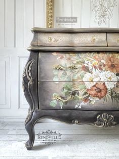 an ornate painted dresser with flowers on it