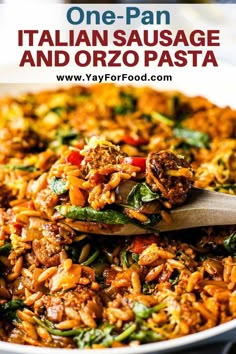 one - pan italian sausage and orzo pasta in a white bowl with a wooden spoon