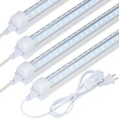 three white led tubes with wires and plugs attached to the end of each tube