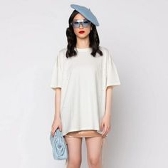 Lost In Your Mind Oversized T-Shirt Dress | S/M, M/L | White | Classic Cotton Fabrication | Small Scattered Distressed Holes | Crew Neckline | Short Sleeve| Relaxed Fit | Pullover Style | Lightweight, Breathable Fabric | Thick & Durable | Hits Mid Thigh | Perfect For Styling As A Layering Piece Over Shorts Or A Super Sexy Mini Skirt | 100% Cotton | 28" Shoulder-Hem | 7" Sleeves (Approx Measured From Size S/M) | Model Wearing Size S/M | Imported Oversized Crew Neck T-shirt Dress For Summer, Relaxed Fit Crew Neck T-shirt Dress For Spring, White Drop Shoulder T-shirt For Spring, Trendy Drop Shoulder T-shirt For Spring, Trendy Drop Shoulder Summer T-shirt, Drop Shoulder T-shirt For Spring, Drop Shoulder T-shirt For Everyday Spring Wear, Drop Shoulder T-shirt For Everyday, Spring Season, White Cotton Crew Neck T-shirt Dress