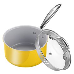 a yellow and silver pot with a lid next to it's side open on a white background