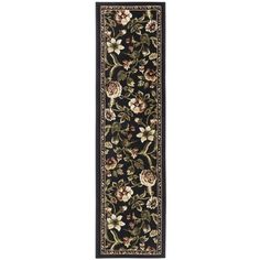 a black and beige rug with flowers on the bottom, in an ornate border design