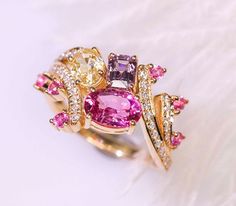 *Condition: Brand new *Center Stone: Natural Pink & Purple Spinel, Yellow Sapphire *Side stones: Natural white diamond round-cut (VS1 clarity and F color) *Ring Weight: 4.14ct *Metal Purity: Optional *Each piece is made-to-order with care and special attention to detail. all items are made with conflict-free diamonds and gems. *The item will be gift wrapped and shipped. ------------------------------------------------------------------- Available in : 14k Rose or Yellow Gold, White Gold 18k Sapphire Side Stones, Luxury Jewelry Box, Ring Cluster, Spinel Ring, Pink Spinel, Handmade Engagement Rings, Buying An Engagement Ring, White Diamond Ring, Bracelet Design