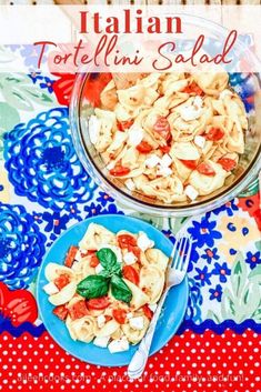 a plate of pasta with tomatoes and basil on it next to a bowl of fettuccine