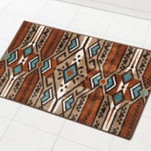 an area rug on the floor with white tiles and blue, brown, and orange designs