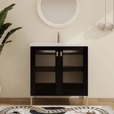 a bathroom with a black cabinet, mirror and potted plant on the floor next to it