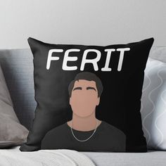 a black and white throw pillow with the words ferit on it, in front of a