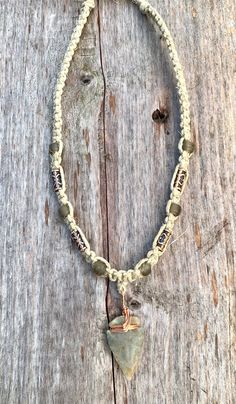 This handcrafted hemp choker features a unique arrowhead pendant made from flint stone, wrapped in copper wire. The pendants vary slightly in size, color, and texture, ensuring every piece is one-of-a-kind. Customizable lengths from 14 to 20 inches make this an adaptable accessory for any style. Ideal for lovers of primitive or tribal-inspired jewelry, this necklace showcases earthy tones and natural craftsmanship, perfect for men or anyone embracing bohemian aesthetics. Proudly made in the USA, Adjustable Earthy Necklaces With Waxed Cord, Adjustable Waxed Cord Hippie Necklace, Bohemian Necklace With Sliding Knot On Waxed Cord, Rustic Adjustable Necklace With Waxed Cord, Festival Necklace With Adjustable Cord, Adjustable Rustic Necklace With Waxed Cord, Adjustable Wire Wrapped Arrowhead Necklace, Adjustable Cord Necklace For Festivals, Hippie Jewelry With Sliding Knot In Waxed Cord