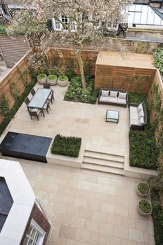 an aerial view of a patio with seating and trees