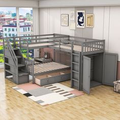 a loft bed with stairs is shown in this room, and there are pictures on the wall