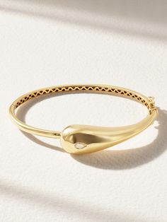 The purity of Mateo's 'Droplet' bracelet is conveyed by its name. It's sculpted from 14-karat gold in a dynamic silhouette that's set with a glistening diamond. The inner band's intricate cutwork glimpses as it moves. Gold Diamond Bracelet, Bracelets Gold Diamond, Raffia Bag, Fine Jewelry Bracelets, Fine Watches, Sunglasses Shop, Watches Jewelry, Womens Jewelry Bracelets, Jewellery And Watches