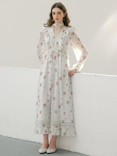 Calf-length, floral chiffon dress. V-shaped neckline, flounce-trimmed, fitted bodice and gently flared skirt. Long balloon sleeves with narrow elastic at cuffs and a lace scarf. Partly lined. - Midi- V-neck- Long sleeves Feminine Spring Dress With Lace Cuffs, Elegant Floral Maxi Dress For Daywear, Feminine Chiffon Midi Dress For Daywear, Elegant Chiffon Dress With Ruffle Hem For Garden Party, Feminine Spring Dress With Lace Collar, Chiffon Maxi Dress With Ruffles For Daywear, Spring Brunch Dress With Lace Cuffs, Feminine Spring Midi Dress With Lace Collar, Spring Midi Dress With Lace Cuffs