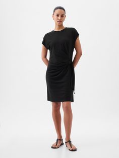 Soft cotton-modal blend mini T-shirt dress.  Crewneck.  Short sleeves.  Tie-knot at hip.  * Fit: Relaxed.  A blouson silhouette that's easy at the chest & cinches above the waist to create fullness.  * Style Note: For a more Classic fit, go down one Cheap Fitted Cotton Shirt Dress, Cheap Shirt Dress For Work, Cheap Fitted Shirt Dress For Work, Affordable Black Shirt Dress For Fall, Black Shirt Sleeve Dress, Affordable Fitted Cotton Shirt Dress, Affordable Fitted Shirt Dress For Date Night, Womens Basic Dresses, Gap Sweatshirt Dress