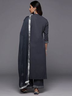 Grab this beautiful 3-piece set. The set comes with gota embroidered straight shape kurta has mandarin collar, 3/4th flared sleeves & calf length teamed with solid trouser pant with slip on closure & elasticated waistband and a dupatta. Color - Grey Kurta Fabric-Cotton Blend Pant Fabric-Cotton Blend Dupatta Fabric - Silk Chiffon Neck-Mandarin Collar Sleeves-3/4th Sleeves Work - Gota Embroidery Detailing Washing Instructions-Dry Clean DISCLAIMER - The color of the product may be differ due to scr Elegant Cotton Sharara For Navratri, Elegant Cotton Palazzo Set For Diwali, Formal Cotton Dupatta, Long Sleeve Georgette Kurta With Embroidered Border, Elegant Cotton Sharara With Straight Kurta, Elegant Cotton Sharara, Elegant Cotton Sets For Diwali, Festive 3/4 Sleeve Sets, Elegant Cotton Sharara For Diwali