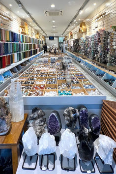 a store filled with lots of different kinds of rocks and stones on display next to each other