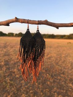 Copper and Black Beaded Earrings Black Bohemian Earrings With Ear Wire, Black Beaded Dangle Chandelier Earrings, Black Drop Earrings With Dangling Beads, Black Beaded Chandelier Drop Earrings, Black Dangle Earrings With Black Beads, Black Beaded Chandelier Earrings As Gift, Elegant Black Beaded Fringe Chandelier Earrings, Black Beaded Fringe Earrings With Round Beads, Black Beaded Earrings With Round Beads And Fringe