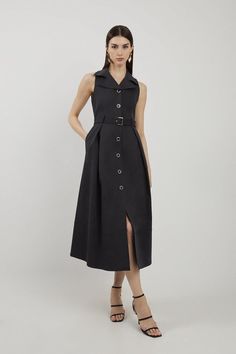 Feel Confident In Our Midi Dress, With A Shirt Style Bodice Featuring A Formal Collar, As Well As A Belted Waist For A Cinched Silhouette, And A Long, Flared Skirt. Style It With Block Heels Or Ankle Boots For A Look Perfect For Office Days, Then Wear It With Heeled Boots Or Strappy Heels For An Evening Look. Tailored Cotton Halter Neck Belted Full Skirted Shirt Dress High Quality Cotton Fabric Flattering Fit And Flare Silhouette V Neckline Unique Collar Detailing Belted Waist Feature Button Fro