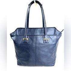 Navy Blue!! Who Doesn't Need More Of This Perfect Neutral In Their Wardrobe? This Coach Taylor F25941 Navy Blue Leather North South Large Tote Shoulder Bag Has Brass Hardware Which Gives It Even More Of Luxe Look. The Front Has A Large Slip Pocket That Any Size Phone Will Fit In. The Back Has The Same Pocket. Inside Is A Zipped Pocket And 2 Slip Pockets. Very Good Condition. Minimal Normal Wear. Wear On Base Of Each Strap (See Pics). The Straps Are Still Very Functional. This Is A Pre-Owned Item Classic Blue Bag For Shopping, Blue Satchel Bag For Business, Blue Business Satchel Bag, Elegant Blue Soft Leather Shoulder Bag, Classic Blue Bags For Daily Use, Classic Blue Shoulder Bag For Travel, Blue Rectangular Shoulder Bag For Business, Blue Tote Office Bags, Blue Tote Bag For Office