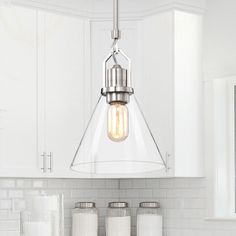 a light fixture hanging over a kitchen counter