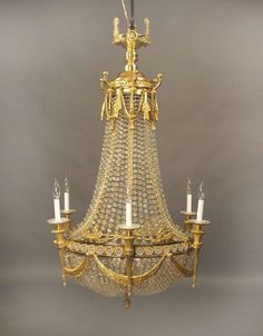 a gold chandelier hanging from the ceiling