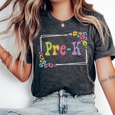 Whether you're looking for a fun and unique gift for a teacher friend or want to treat yourself to something special for the first day of school, this Pre-K Teacher shirt is sure to bring a smile to your face and to your students'. Find more back to school shirts, sweatshirts and gifts for your favorite Pre K teacher here: https://www.etsy.com/shop/JaxGraphicTees?search_query=pre-k All of our adult t-shirts are Bella + Canvas 3001 Unisex shirts. They are a super soft fabric that will quickly become a go to in your wardrobe. Its lightweight and flexible material is perfect for casual wear or any activity. Sizing details: * All shirts are unisex sizing, please refer to the size chart in the listing photographs to determine your size. * If you are not sure what size to order, you can measure Fun Short Sleeve Tops For Daycare, School Spirit Tops With Funny Print For Teacher Appreciation, Customizable Cute Tops For School, Cute Customizable Tops For School, Trendy Multicolor School Shirt, Funny Pre-shrunk Tops For School, Fun Multicolor Shirt For End Of School Year, Pre-shrunk Crew Neck Top For Daycare, Multicolor Short Sleeve Tops For Back To School