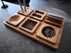 an assortment of wooden utensils are arranged on a tray