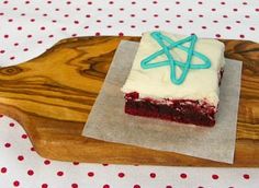 a piece of cake sitting on top of a wooden tray