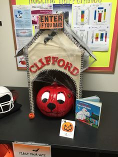 a halloween decoration with a dog house and pumpkin