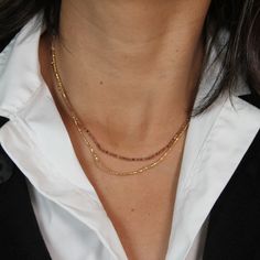 One of our favorite Mabel Chong necklaces! This double-style necklace features a strand of faceted Andalusite beads and a strand of Gold Filled beads attached to a 16" Gold Filled Cable Chain with an adjustable length. Get a beautiful layered look in one piece! Approx. Length: 16-18" Adjustable Adjustable Chain Necklace With Round Tiny Beads, Multi-strand Beaded Chain Necklaces For Gift, Gold Beaded Necklaces With Faceted Beads For Everyday, Gold Beaded Necklace With Faceted Beads For Everyday, Dainty Faceted Necklaces, Gold Multi-strand Beaded Necklaces With Faceted Beads, Gold Crystal Necklaces With Round Beads For Everyday, Adjustable Lariat Necklace With Faceted Beads, Beaded Double Strand Chain Necklace As Gift