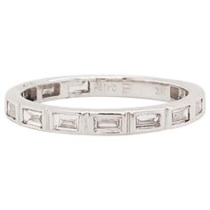 This modern diamond baguette band is a clean, sleek design. With natural baguette diamonds set East to West in bezel settings. This band has a seamless, bright white look! The diamonds are G-H color and VS-1 Clarity, very clear and very white! The bezel settings frame each diamonds perfectly with a bright white 14k white gold. This ring is so beautiful worn alone or can be paired with your engagement ring or right hand ring! It's versatile and looks great with everything. Frame this band between Modern White Gold Diamond Ring With Baguette Diamonds, Modern White Diamond Ring With Baguette Diamonds, Modern Silver Diamond Ring With Baguette Diamonds, Modern Diamond Ring With Baguette Diamonds, Modern Round Cut Diamond Ring With Baguette Diamonds, Modern Channel Set Baguette Cut Diamond Ring, Modern Cubic Zirconia Diamond Ring With Baguette Cut, Modern Baguette Cut Diamond Ring With Bezel Setting, Diamond Baguette Band