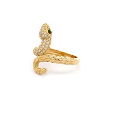 Infuse a touch of boldness and elegance with our snake ring. The intricate snake design features a sparkling head adorned with cubic zirconia stones and piercing green eyes, all set in 14k yellow gold. A stunning accessory that will make heads turn and spark conversations! Metal: 14k Gold Stone: Cubic Zirconia Type: Ring Size: 8 We size up to two sizes free of charge. Please contact us for pricing on resizing more than two sizes. We need 2-3 business days to resize this ring. We do not accept re Luxury Snake-shaped Diamond Ring, Luxury 14k Gold Snake-shaped Ring, Formal Diamond Snake-shaped Ring, Luxury Snake-shaped Jewelry For Anniversary, Luxury Yellow Gold Snake Shaped Ring, Elegant Yellow Gold Snake Diamond Ring, Snake-shaped Diamond Accented Jewelry For Anniversary, Snake Shaped Jewelry With Diamond Accents For Anniversary, Diamond Snake Ring Fine Jewelry