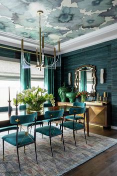 the dining room is decorated in blue and green