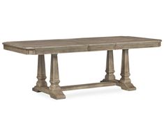 a wooden table with two pillars on the top