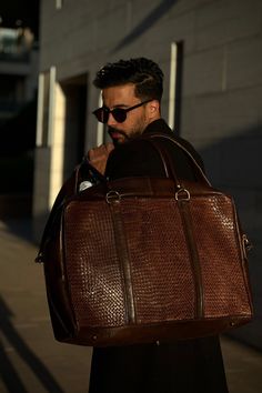 Elevate every escape with our Handwoven Leather Duffle. Uncompromising in style, it's the perfect companion for your jet-setting lifestyle. Modern Laptop Bag With Removable Pouch, Modern Rectangular Laptop Bag With Removable Pouch, Tote Briefcase With Top Carry Handle For Business Trips, Tote-shaped Briefcase With Top Carry Handle For Business Trips, Modern Rectangular Cases For On-the-go, Business Trips Tote Briefcase With Top Carry Handle, Business Trip Briefcase With Top Carry Handle, Luxury Satchel Backpack For Travel, Leather Travel Accessories With Removable Pouch For Everyday Use