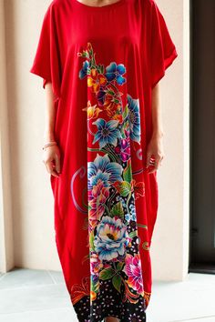 This elegant red dress is adorned with beautiful and delicate bougainvillea, peony and lilies. It is perfect for those days when you just feel feminine and powerful. The caftan fits women sized XS to 3XL. The beautiful model Lucya usually wears size S/M. Red Floral Print V-neck Kaftan, Elegant Red Floral Print Kaftan, Red V-neck Kaftan For Spring, Vibrant Red Floral Print Maxi Dress, Vibrant Red Maxi Dress With Floral Print, Red Floral Print Long Maxi Dress, Spring Red Maxi Length Kaftan, Red Spring Maxi Length Kaftan, Red Short Sleeve Kaftan For Spring