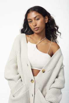 This Navi Oversized Cardigan features chunky short-rowing and intricate pointelle holes that provide a cozy look and unbeatable comfort. Enjoy the oversized cut and classic design that makes this cardigan perfect for any occasion. Oversized fit. If you are an XS-S we recommend getting size S. If you are a M-L we recommend getting size L. 100% Wool Model is 5'7" and wearing a size small Silver Lining, Oversized Cardigan, Arm Sleeve, Rowing, Oversized Fits, Classic Design, Sleeve Length, Top Outfits, Size Small