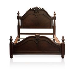 a wooden bed frame with ornate carvings on the headboard and foot board, against a white background