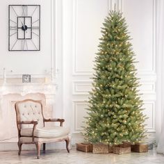 Get into the holiday spirit with this slender artificial Fir Christmas tree, pre-lit with warm lights for a cozy ambiance. Its hinged branch construction and PVC tips make setup a breeze, while the included metal stand ensures stability. The tree's slender shape is perfect for smaller spaces, bringing festive cheer to every corner of your home. Plus, the stay-lit bulbs keep shining even if one goes out. So, gather around with family and friends, and let the tree-lighting festivities begin! Kelly Slim Christmas Trees, Slim Artificial Christmas Trees, Slim Christmas Tree, Fraser Fir, Fir Christmas Tree, Pre Lit Christmas Tree, Kelly Clarkson Home, Led Color Changing Lights, White Lights