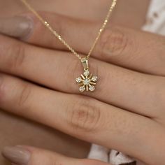 Features Yellow gold and white diamond Material: Solid Gold (not gold plated or gold filled) Available Gold Color: Yellow gold, rose gold and white gold Karat: 14 K (585) Number of Stones: 6 Total CTW: 0.07 Ctw Diamond color: F-G Color Gold grams: 2.10 gr Chain length: approximately 16.5 in / 42 cm Available with or without chain Made to order Available in 4 different chain lengths: 42 cm (16.5 in), 46 cm (18 in), 47 cm (18.5 in) or 49 cm (19 in). Model wears the 42 cm length. As with all of our Fine Jewelry Diamond Flower Jewelry, Fine Jewelry Diamond Flower, Rose Gold Jewelry With Diamond Accents, Flower Shape, Diamond White Diamond Flower-shaped Jewelry, Flower Shaped Diamond Cut Jewelry, Diamond White Flower-shaped Diamond Jewelry, Rose Gold Flower-shaped Jewelry With Diamond Accents, Rose Gold Diamond Flower Jewelry, Rose Gold Flower Diamond Jewelry