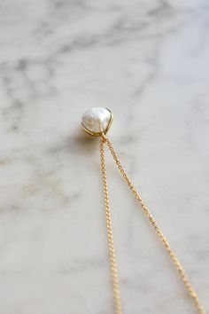 This necklace features a beautiful white baroque cultured freshwater pearl (AAA) set in 18 k solid gold that hangs from a delicate and high quality gold filled chain. This necklace is a timeless piece that makes a perfect gift for many occasions. Pearl is the birthstone for the month of June and makes a lovely birthday gift as well. Minimal simple design, effortlessly chic. Wear it on its own or layer it with other necklaces. Made using the highest quality USA and UK sourced materials. 📦 Eco-friendly packing I try my best to use as little plastic as possible in my packaging. Each order will arrive wrapped in a sweet eco-friendly and biodegradable glassine paper bag, ready for gift giving.  I use ONLY 100% recyclable mailers and 100% biodegradable product packaging. D e t a i l s : => Meta Akoya Pearl Pendant Necklace Gift, Graceful Pearl Chain Jewelry Gift, Fine Jewelry Pearl Necklace With Pearl Chain As Gift, Graceful Pearl Pendant Jewelry As A Gift, Baroque Pearl Pendant Long Necklace, White Baroque Pearl Jewelry With Gemstone, White Pearl Necklace Clavicle Chain For Anniversary, Gold-plated Pearl White Necklace As Gift, White Pearl Necklace With Clavicle Chain For Anniversary