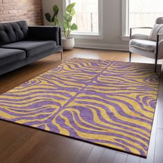 a purple and yellow rug in a living room