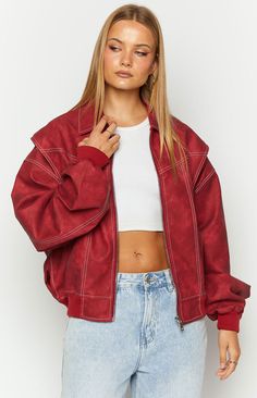 Crimson Bomber Jacket by Lioness

How to Style:
Elevate your outfit with this crimson bomber jacket ()! The perfect addition to any outfit - place over a mini dres ()s for dinner with the girls or jeans for a casual () day out shopping. 

Features:

  
 * Fully lined  
 * Heavy weight  
 * White contrast stitching 
 * Cuffed sleeves  
 * Elastic bottom hem 
 * Oversized style 
 * Front centered zip 
 * Collared Red Zip Fly Outerwear For Fall, Trendy Red Track Jacket For Fall, Trendy Long Sleeve Varsity Jacket With Zipper Closure, Dress For Dinner, Mini Dres, Prom Midi Dress, Summer Playsuit, Sweater Crop, Beginning Boutique