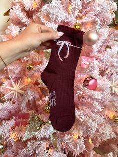 Our Put A Bow On It - Burgundy Socks are the perfect cozy addition to your holiday wardrobe! These socks feature a stunning white ribbon on the top and slight ruffle hem. If you’re looking for the perfect holiday socks to pair with your Uggs, these are it! All accessories are final sale. Holiday Socks, Holiday Tops, Holiday Wardrobe, Choose Happy, White Ribbon, Dress With Cardigan, Ruffle Hem, On The Top, Final Sale