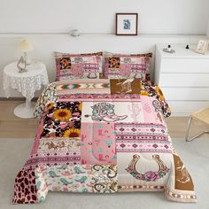 a bed covered in pink and brown patchwork