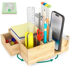 a wooden desk organizer with pens, pencils, scissors and an iphone in it