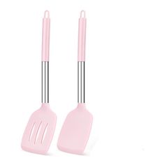 two pink kitchen utensils sitting next to each other