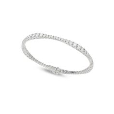 The Charming Tennis Bracelet features a delicate string of linked diamonds, each meticulously poised and set in a classic design that has captivated hearts for generations. Designed to be versatile, it effortlessly complements a wide range of styles and occasions. Adorn your wrist with the diamond tennis bracelet—a testament to the profound simplicity that makes life exquisite. Flexible Diamond Bracelet Fine Jewelry, Elegant Flexible White Gold Bracelet, Classic White Gold Bangle Chain Bracelet, Elegant White Gold Bangle For Everyday Wear, Classic Flexible Cubic Zirconia Diamond Bracelet, Classic Jewelry With Flexible Cubic Zirconia, Classic Flexible Jewelry With Cubic Zirconia, Timeless White Gold Jubilee Bracelet, Classic Flexible Jewelry In Cubic Zirconia